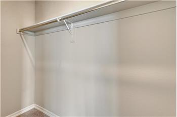 Primary Bedroom walk in closet.