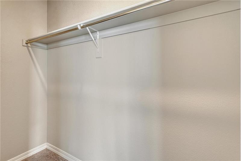 Primary Bedroom walk in closet.