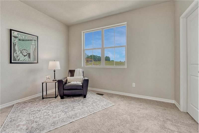 Upper level Bedroom #2 has neutral carpet, private adjoining Full Bathroom, and walk in closet.