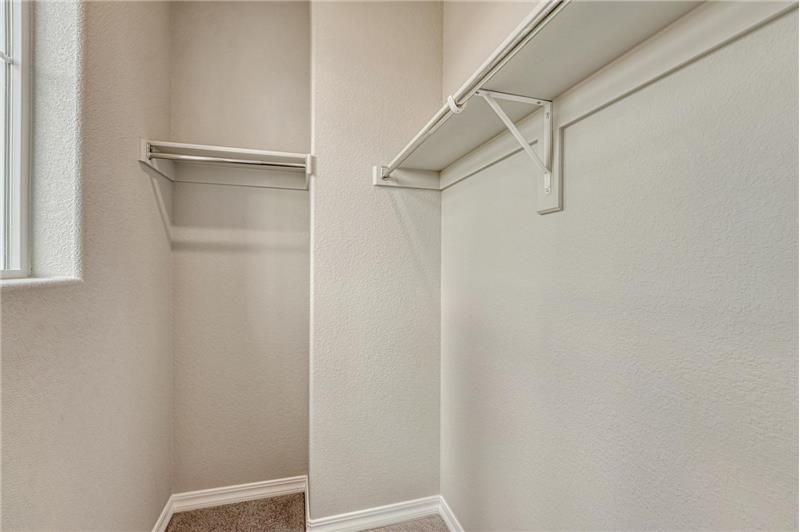 Walk in closet in upper level Bedroom #2.