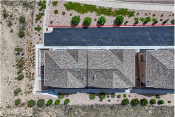 Aerial view of building and lot.