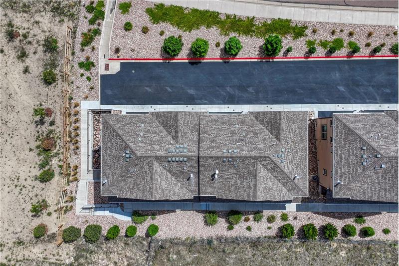 Aerial view of building and lot.