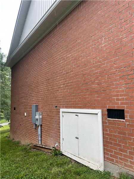 Crawl space entrance to Storm Shelter