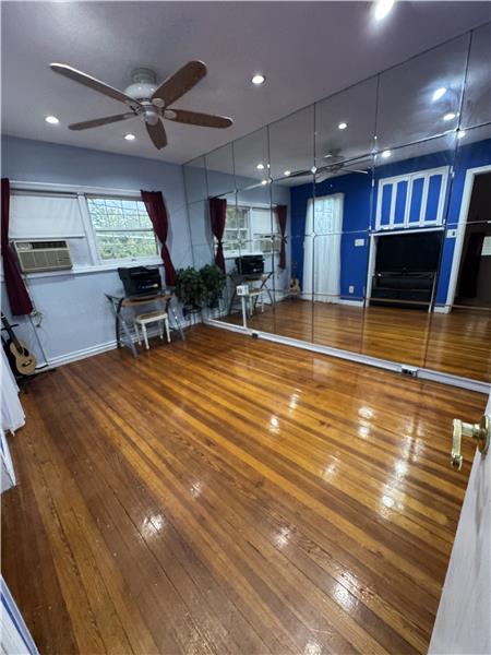 Bedroom in Front of house has a walk in closet.