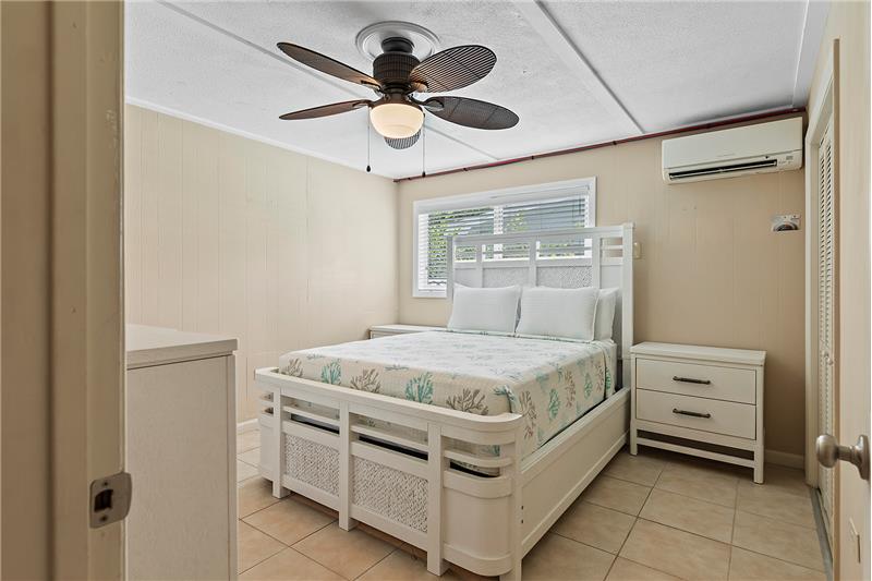 Cozy comfort awaits in our second bedroom retreat, complete with a queen-sized haven and A/C.
