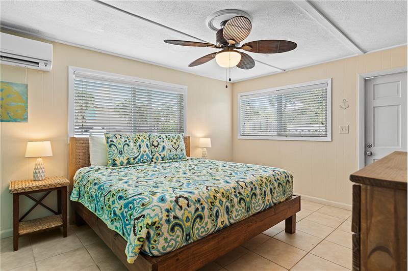 King-sized comfort awaits in this serene master bedroom with A/C.