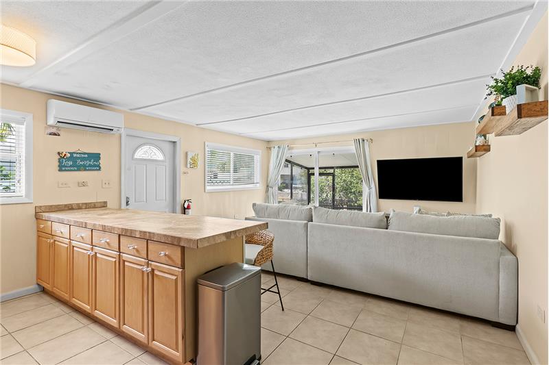Entertainment meets culinary delight: Gather around our kitchen counters, conveniently close to the living room TV for seamless 