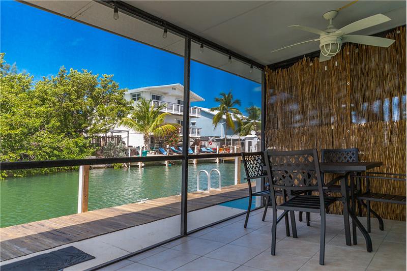 Enjoy the breeze in our screened-in lanai.
