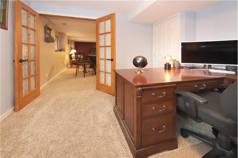 French doors lead into the Basement Bedroom/Office