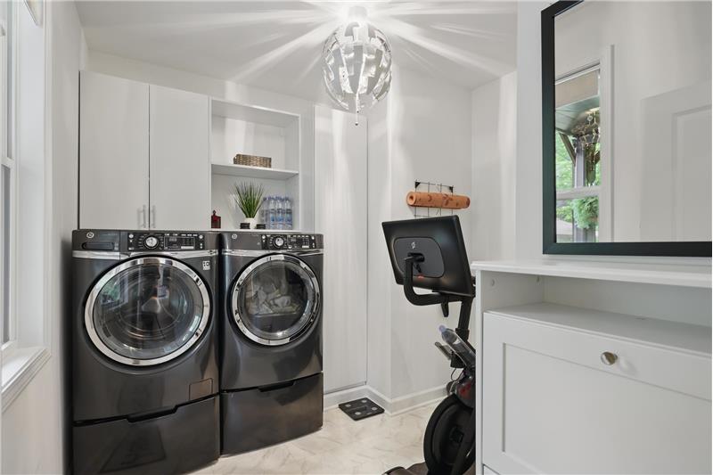 Large laundry room with upgraded cabinetry