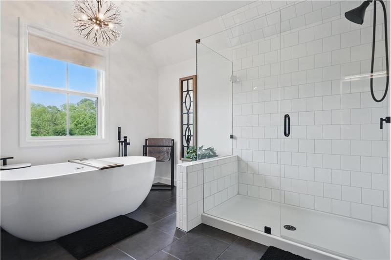 Separate soaking tub and frameless shower 