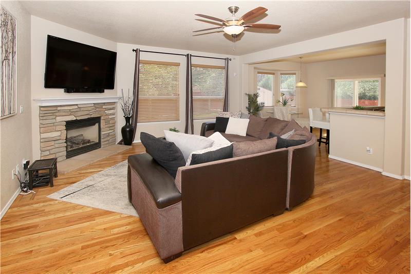 Living room with hardwood flooring and gas fireplace