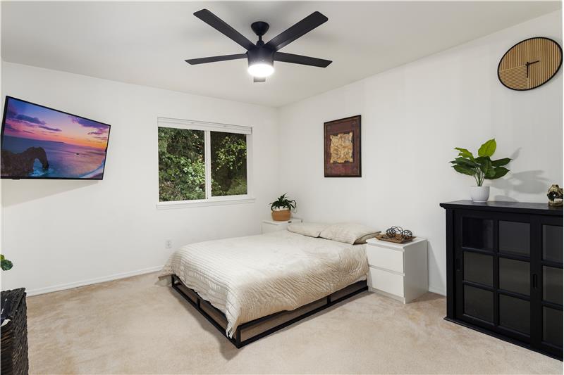 Third bedroom upstairs, looks over back yard. Very tranquil and private feeling.
