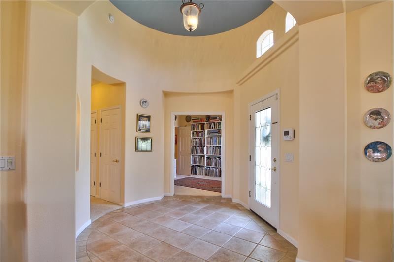 The raised ceiling of the foyer and the spaciousness of the entry.