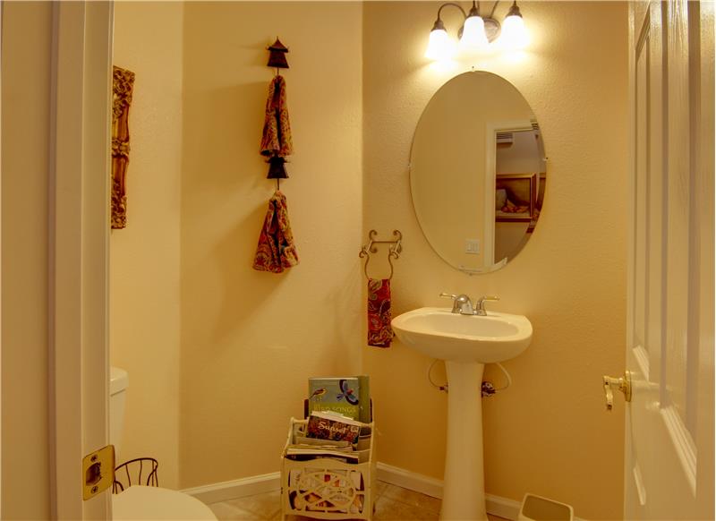 The Guest Bath, charming everyone with its pedestal sink and oval mirror! Very cute!