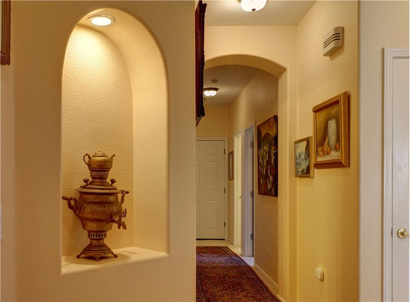 Speaking of space...there is more! Like, how about lighted wall alcoves for your favorite piece of art or photos?