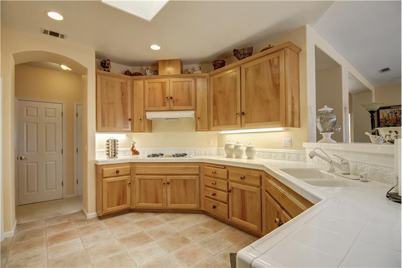 The vaulted ceiling, the natural light coming down and its sheer size make large gatherings easy in this Kitchen.