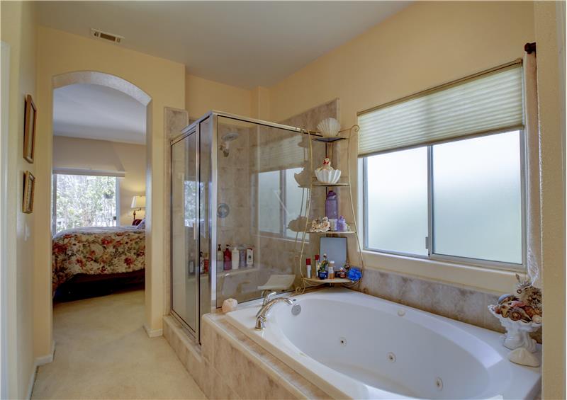 En Suite Bath offers both a jetted tub and a separate shower! A private water closet is to left, out of picture.