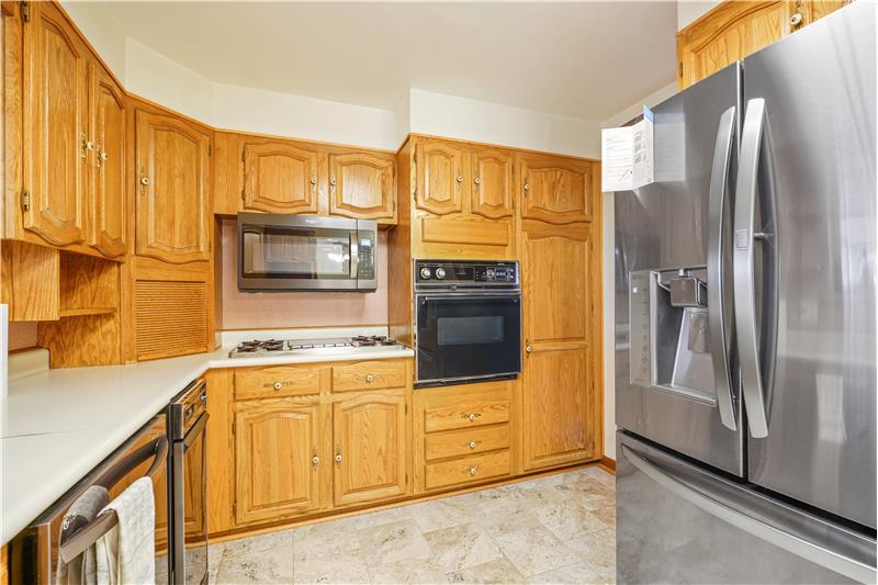 All appliances included. Note gas cooktop and electric wall oven
