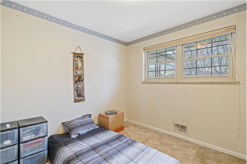 Bedroom with high window to front yard