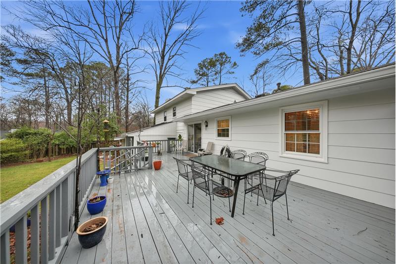Deck overlooking lovely backyard