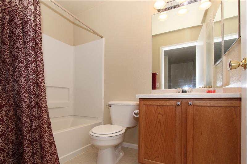 Full bath on upper level provides access to bedrooms and adjoins to bedroom 2