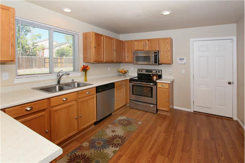 Kitchen with stainless steel appliances, recessed lighting, and plenty of cabinet storage and counter top space!
