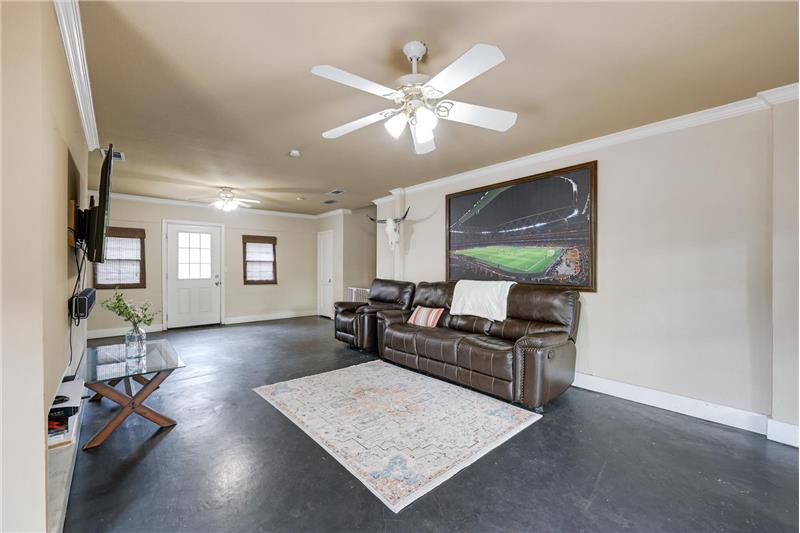 Separate game room is huge and features a balcony and half bath