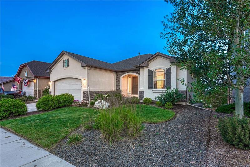 Beautifully appointed 5BR, 3BA ranch-style stucco/stone home on a 0.14-acre lot in the popular Villages at Wolf Ranch.