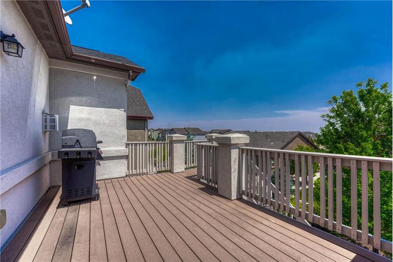 Wood deck with stairs to the backyard.