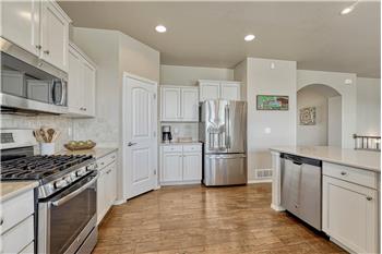 The Kitchen offers a gas range oven, microwave, dishwasher, and French door refrigerator.