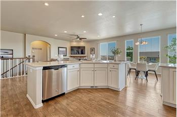 View of the Living Room and Dining Area from the Kitchen.
