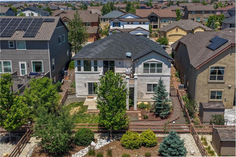 Aerial rear view of home and backyard.
