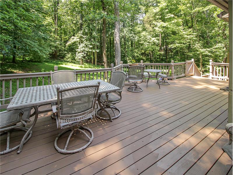 Relax or dine on huge deck across back