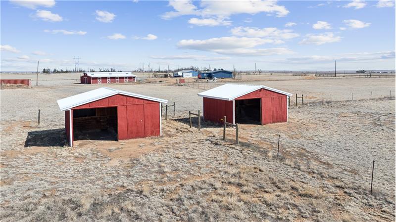 Two loafing sheds with storage.