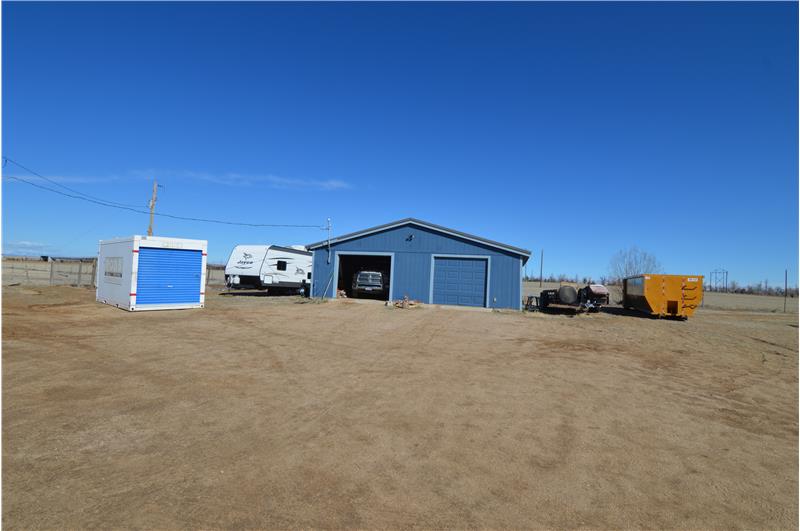 Huge garage with room for workshop.