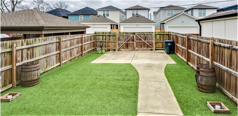 Fenced back yard with enclosed 2-car parking pad.  Perfect for pets!