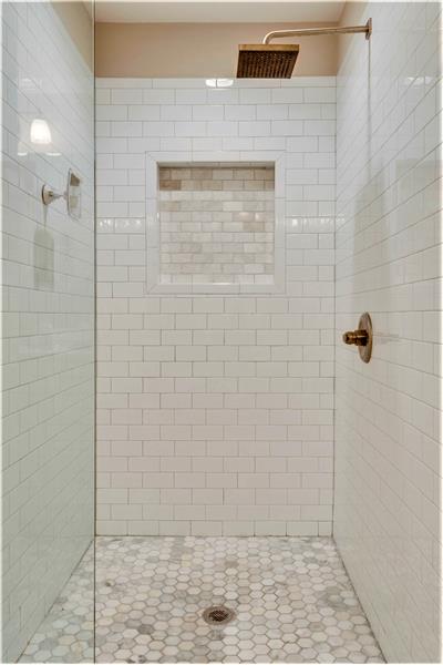 Over-sized tile shower with rain-head fixture