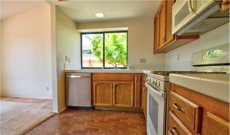 Original flooring and counter, but a newer Stainless Steel Dishwasher? Yep, a few upgrades.
