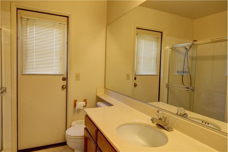 Perfectly Positioned Main Bath has Benefit of Low Threshold Shower! (PLUS an Exterior Door!)