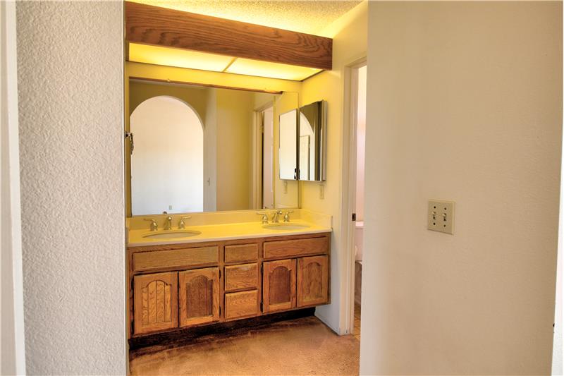 Matching Wood Cabinetry throughout home, Master Vanity Enjoys Dual Sinks!