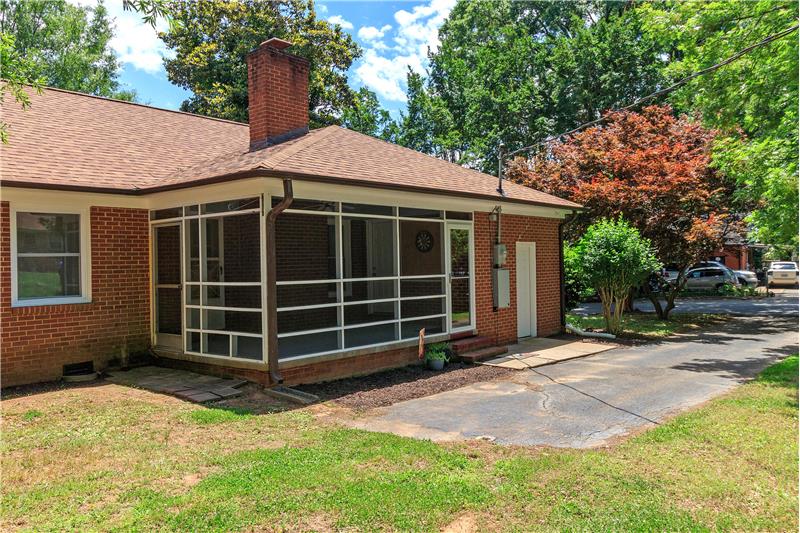 Rear of home with outside storage room