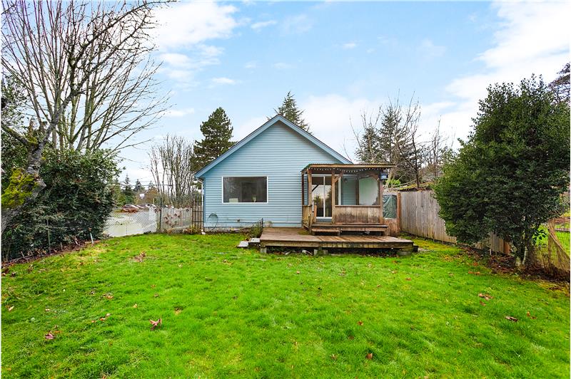 The back of the house showing covered deck.