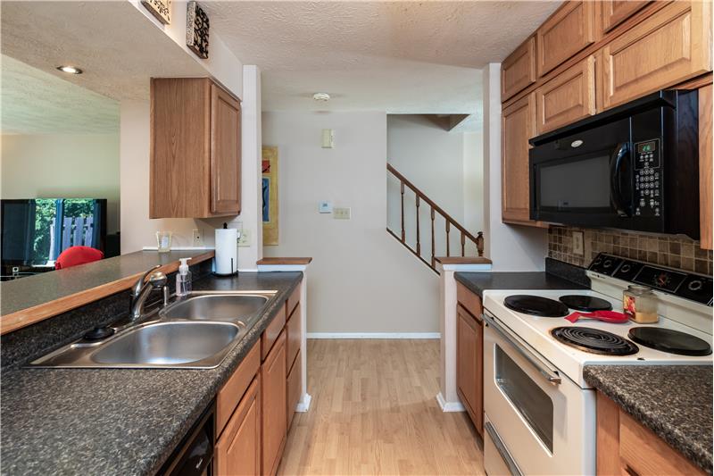 Galley kitchen with all appliances - 6181 E 96th Pl