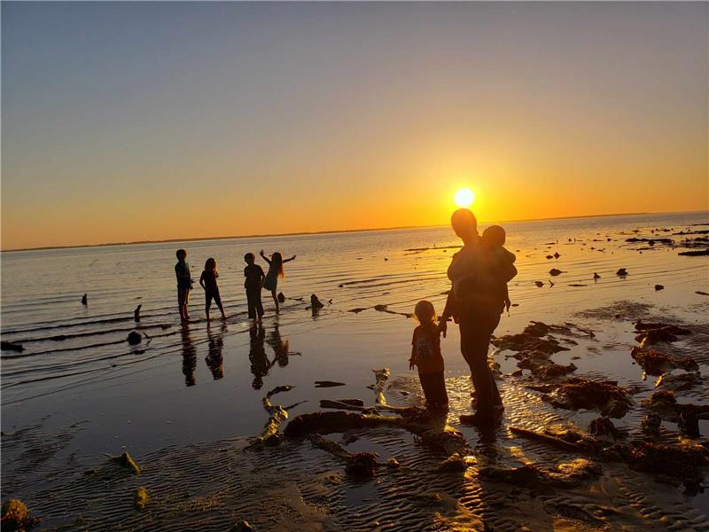 Having joyful fun on the beach at sunset!
