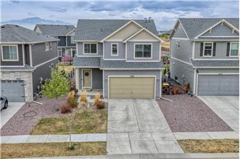 This home has great curb appeal, featuring clean, low-maintenance landscaping & an inviting covered front porch.
