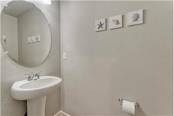 Convenient Powder Bathroom located off the Entry.