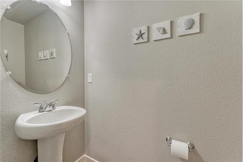 Convenient Powder Bathroom located off the Entry.