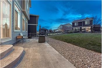 Sunset view of composite patio and backyard.