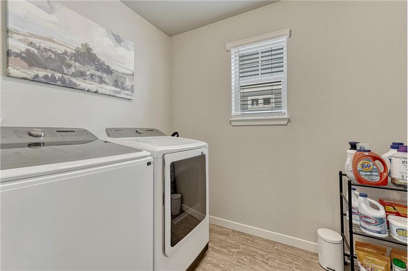 Upper Level Laundry Room with window.